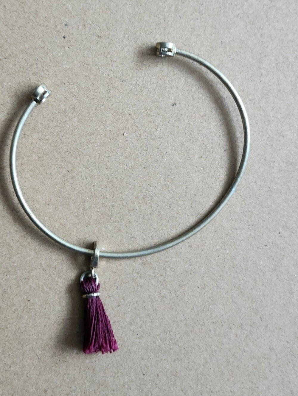 Silver-Tone Open Cuff Bracelet with Plum Tassel Charm